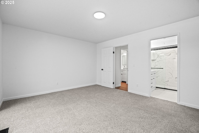 570 N Hayden Bay Dr, Portland, OR 97217 - unfurnished bedroom with carpet flooring, baseboards, and ensuite bath