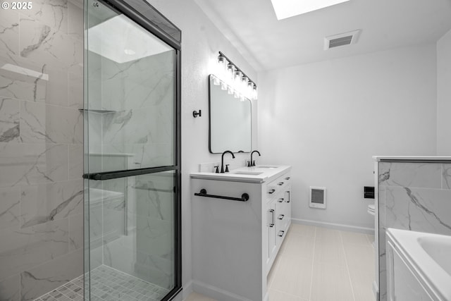 570 N Hayden Bay Dr, Portland, OR 97217 - bathroom with vanity, a marble finish shower, heating unit, a bath, and a skylight