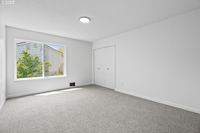 570 N Hayden Bay Dr, Portland, OR 97217 - empty room featuring carpet flooring and baseboards