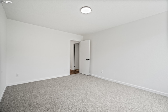 570 N Hayden Bay Dr, Portland, OR 97217 - spare room featuring carpet flooring and baseboards