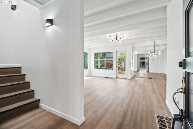 570 N Hayden Bay Dr, Portland, OR 97217 - entryway with a chandelier, light wood-type flooring, baseboards, and stairway