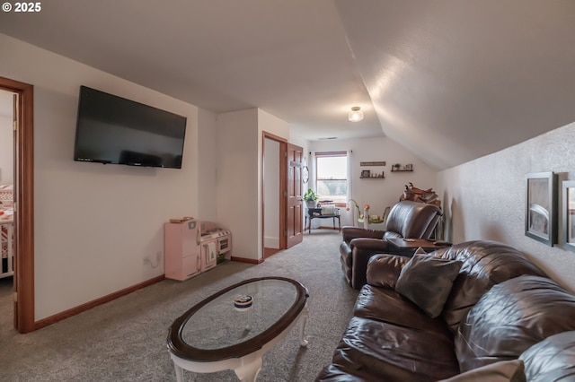 living area featuring light colored carpet, vaulted ceiling, and baseboards