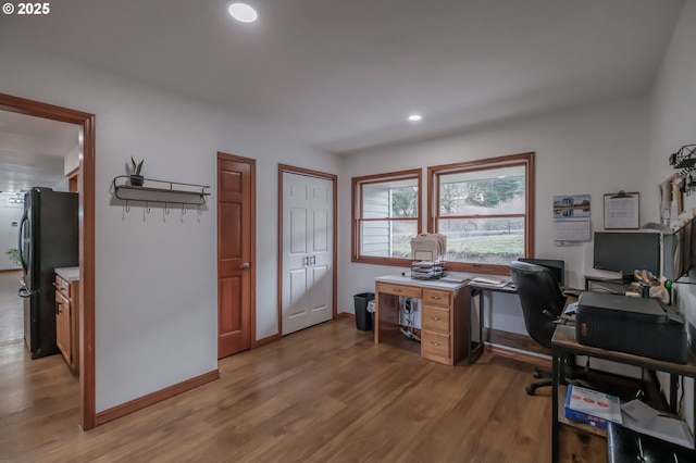 office area featuring recessed lighting, baseboards, and wood finished floors