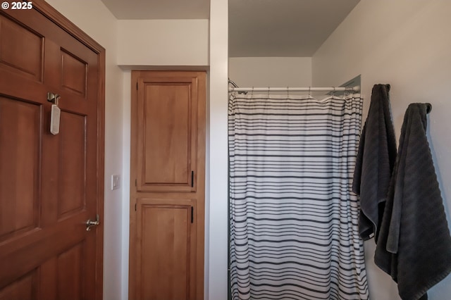 bathroom with a shower with curtain