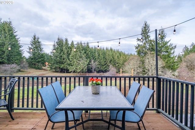 wooden deck with outdoor dining space