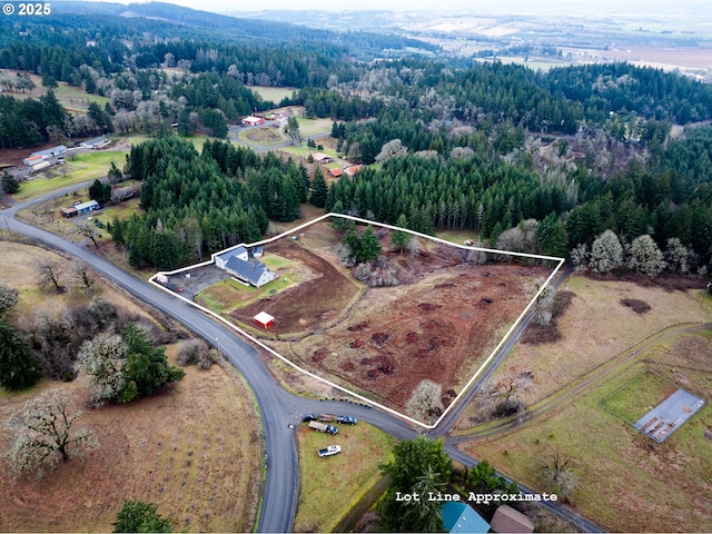 bird's eye view featuring a forest view