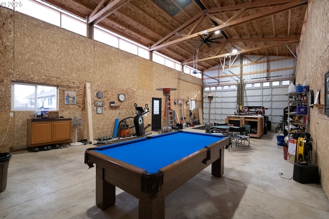 game room featuring a garage, concrete flooring, billiards, and high vaulted ceiling