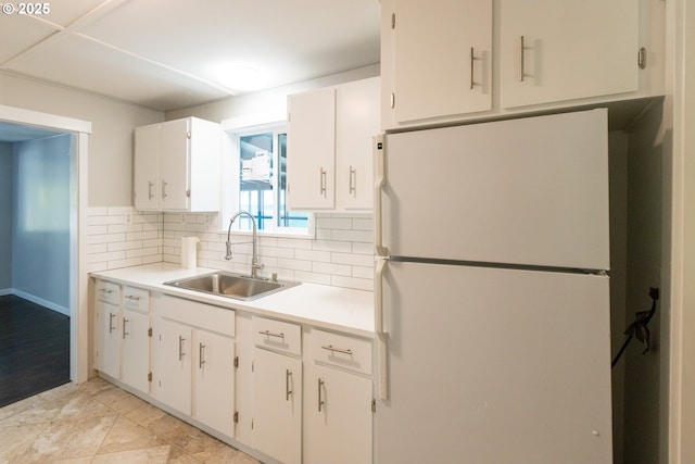 207 N Maple St, Bingen, WA 98605 - kitchen with white cabinets, a sink, light countertops, freestanding refrigerator, and tasteful backsplash