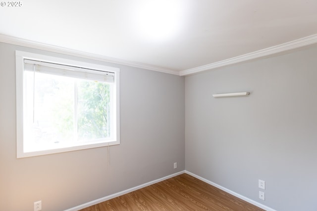 207 N Maple St, Bingen, WA 98605 - spare room featuring crown molding, baseboards, and wood finished floors