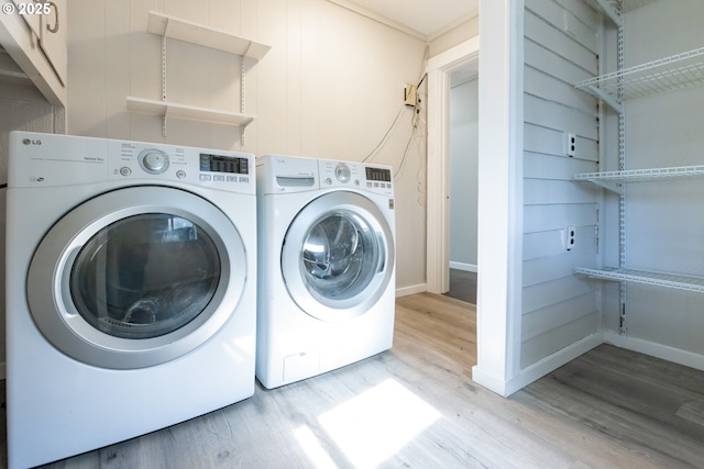 207 N Maple St, Bingen, WA 98605 - clothes washing area with separate washer and dryer, baseboards, and light wood-style flooring