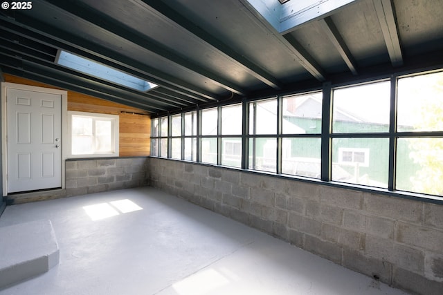 207 N Maple St, Bingen, WA 98605 - interior space featuring concrete flooring, lofted ceiling, and concrete block wall