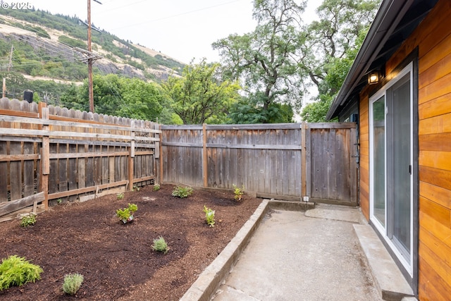 207 N Maple St, Bingen, WA 98605 - view of yard featuring a patio, a mountain view, and a fenced backyard