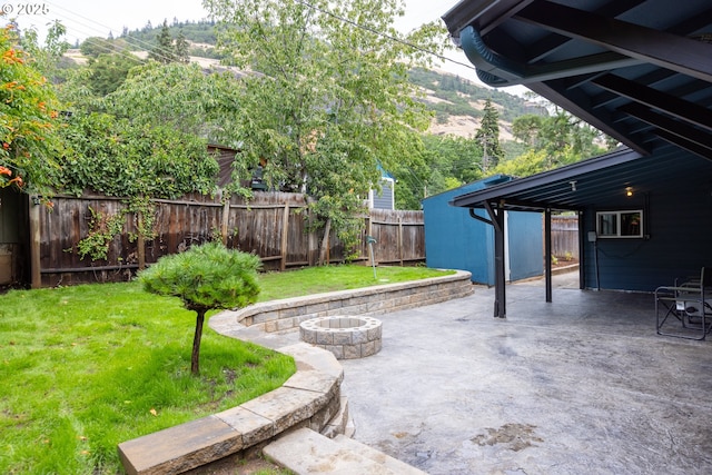 207 N Maple St, Bingen, WA 98605 - view of patio / terrace featuring a fenced backyard, a mountain view, and a fire pit