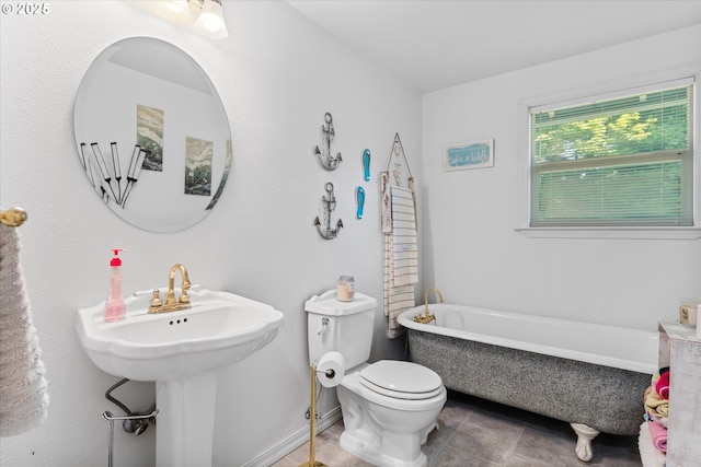22165 SE Mark Rd, Damascus, OR 97089 - full bathroom featuring a freestanding tub, toilet, and tile patterned flooring