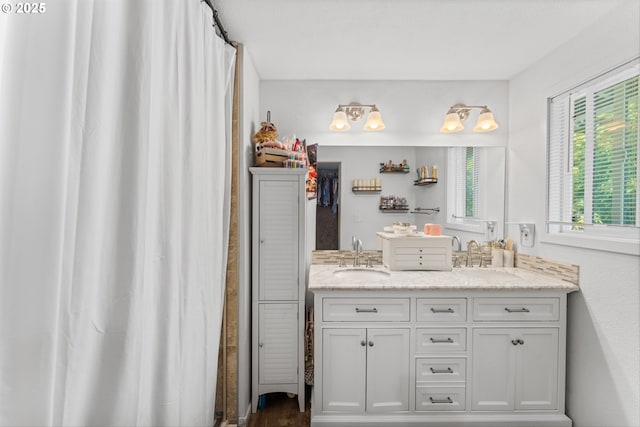 22165 SE Mark Rd, Damascus, OR 97089 - bathroom with double vanity, a shower with curtain, and wood finished floors