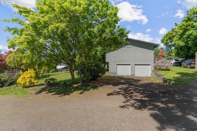 22165 SE Mark Rd, Damascus, OR 97089 - garage featuring asphalt driveway