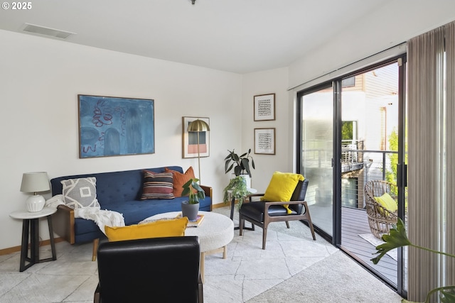 living area featuring baseboards