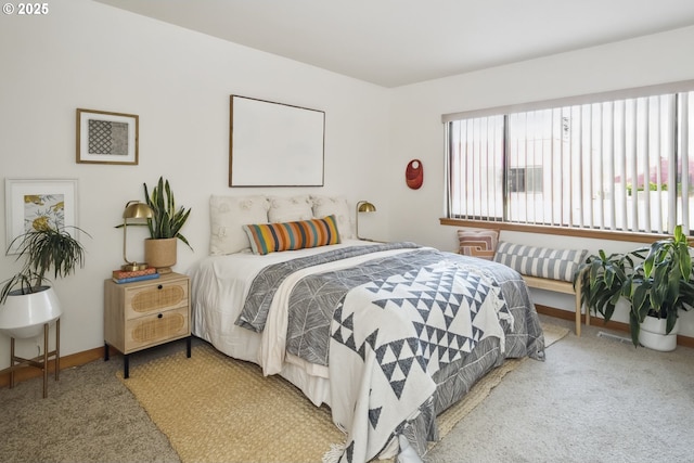 bedroom with carpet flooring and baseboards