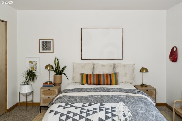 bedroom featuring carpet flooring and baseboards