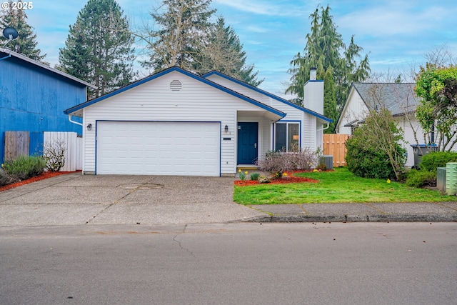 view of front facade featuring fence, a front yard, a chimney, driveway, and an attached garage