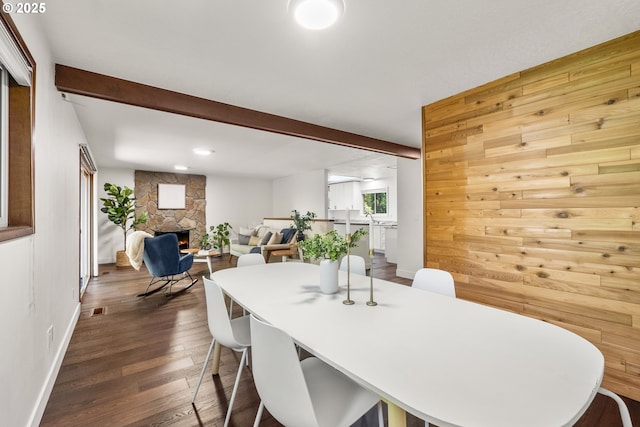 19065 Trillium Dr, West Linn, OR 97068 - dining area featuring dark wood-type flooring, a fireplace, baseboards, beam ceiling, and recessed lighting