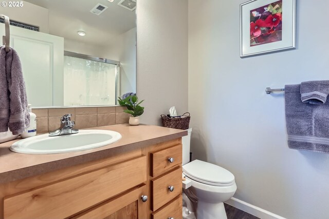 16070 SW Mason Ln, Beaverton, OR 97006 - full bath featuring tasteful backsplash, toilet, vanity, an enclosed shower, and baseboards