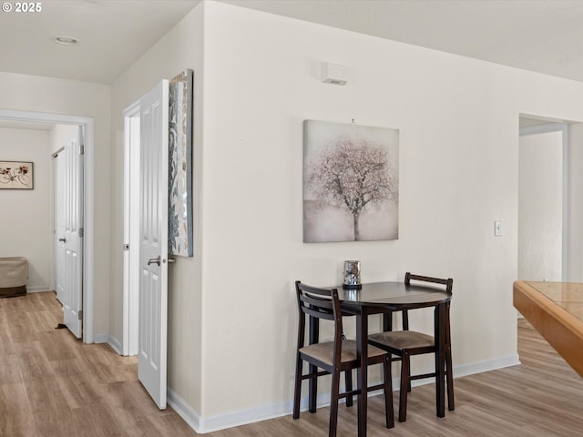 6759 Jasmine Ct, Brookings, OR 97415 - hallway featuring baseboards and wood finished floors