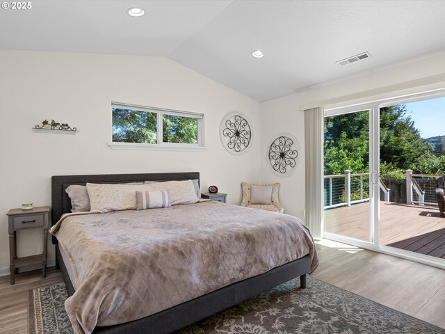 6759 Jasmine Ct, Brookings, OR 97415 - bedroom featuring wood finished floors, access to outside, visible vents, vaulted ceiling, and recessed lighting