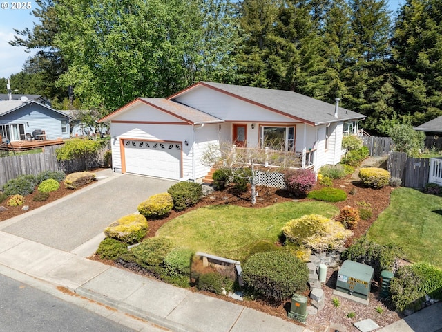 6759 Jasmine Ct, Brookings, OR 97415 - single story home featuring a front lawn, driveway, a garage, and fence