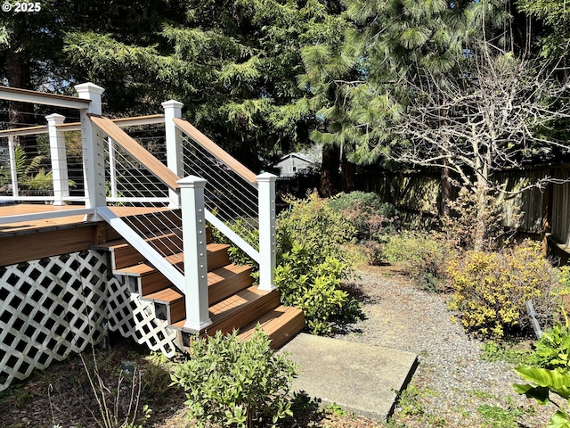 6759 Jasmine Ct, Brookings, OR 97415 - view of yard featuring a deck, stairway, and fence