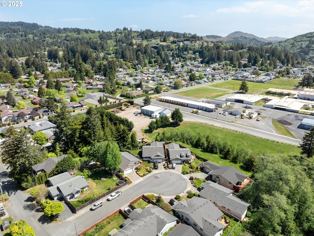 6759 Jasmine Ct, Brookings, OR 97415 - bird's eye view with a wooded view, a mountain view, and a residential view