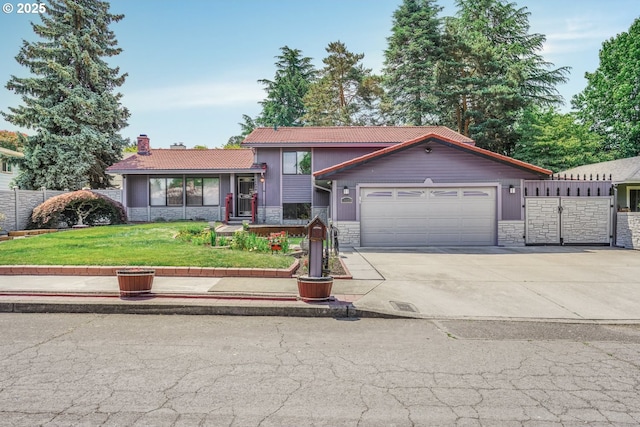 14428 NE Failing St, Portland, OR 97230 - split level home with stone siding, a garage, a chimney, and concrete driveway