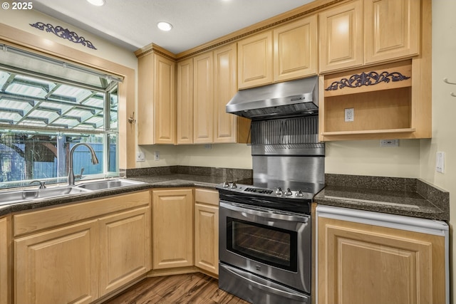 14428 NE Failing St, Portland, OR 97230 - kitchen with under cabinet range hood, stainless steel range with electric cooktop, dark countertops, dark wood-style floors, and open shelves
