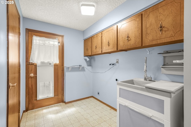 14428 NE Failing St, Portland, OR 97230 - laundry area with cabinet space, light flooring, hookup for a washing machine, a textured ceiling, and hookup for an electric dryer