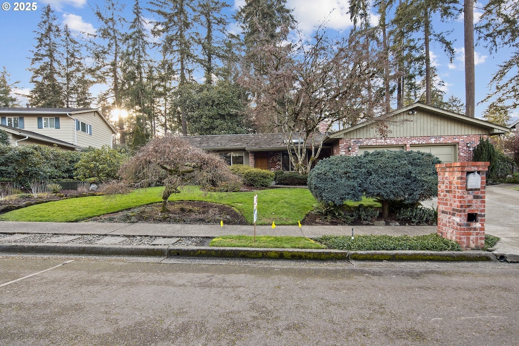 7695 SW 140th Ave, Beaverton, OR 97008 - view of front of home featuring a garage and a front lawn