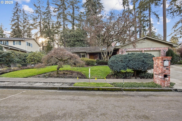 7695 SW 140th Ave, Beaverton, OR 97008 - view of front of home featuring a garage and a front lawn
