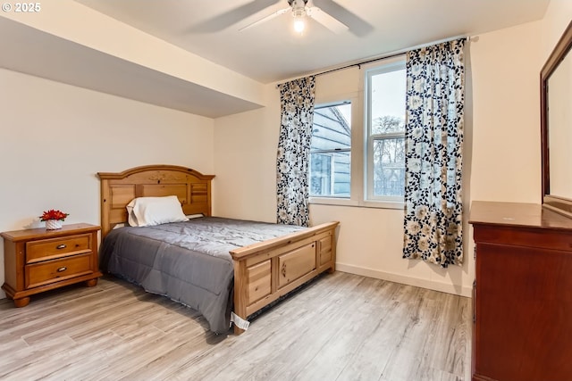 bedroom featuring ceiling fan and light hardwood / wood-style flooring