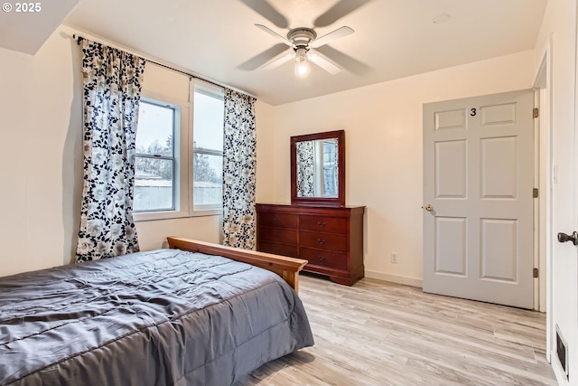 bedroom featuring ceiling fan and light hardwood / wood-style flooring