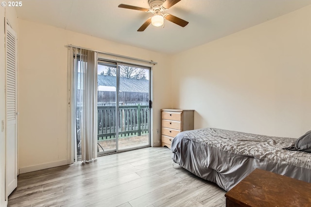 bedroom with ceiling fan, access to exterior, and light hardwood / wood-style flooring