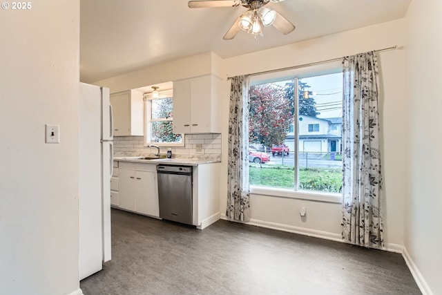 kitchen featuring tasteful backsplash, dishwasher, white cabinets, white refrigerator, and a healthy amount of sunlight