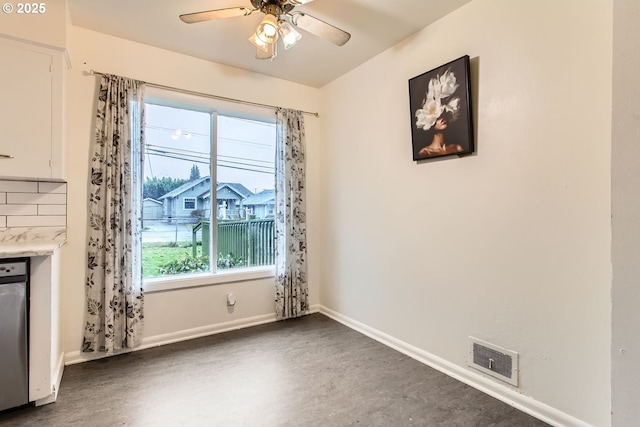 unfurnished living room with ceiling fan