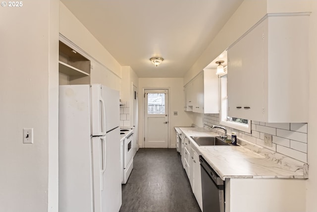 kitchen featuring white appliances, sink, decorative backsplash, and white cabinets