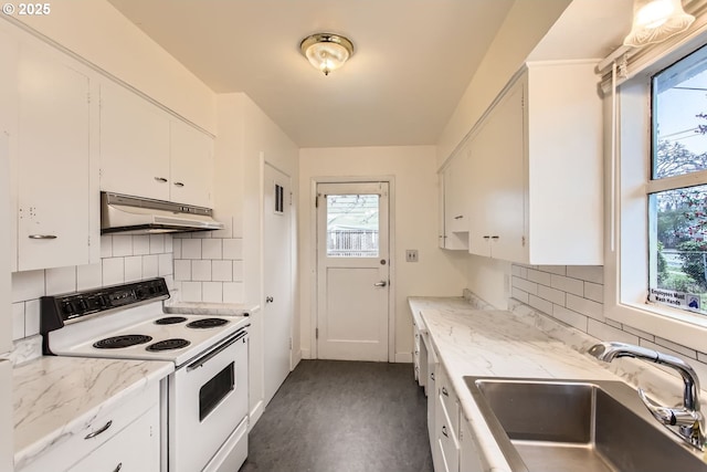 kitchen with sink, plenty of natural light, white cabinets, and white range with electric stovetop