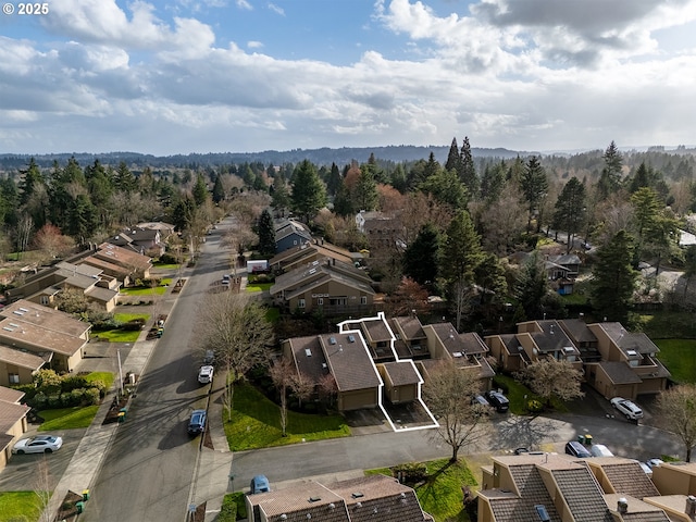 birds eye view of property with a residential view and a view of trees