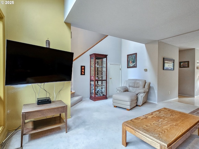 carpeted living room with stairway