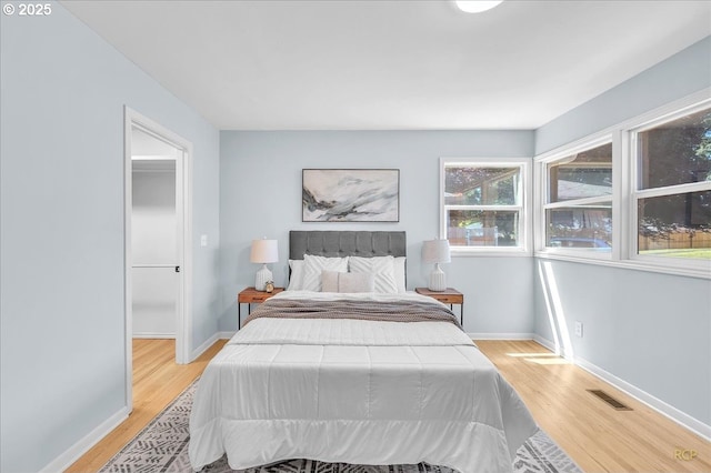 513 SE 103rd Ave, Vancouver, WA 98664 - bedroom with light wood-type flooring and baseboards