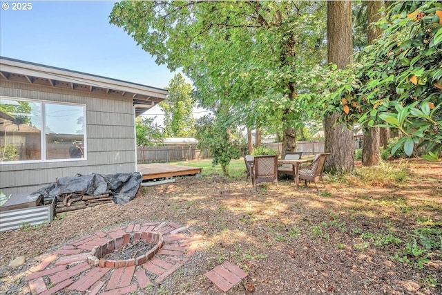 513 SE 103rd Ave, Vancouver, WA 98664 - fenced backyard featuring an outdoor fire pit and a wooden deck