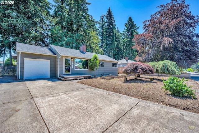 513 SE 103rd Ave, Vancouver, WA 98664 - single story home with an attached garage, concrete driveway, and a chimney