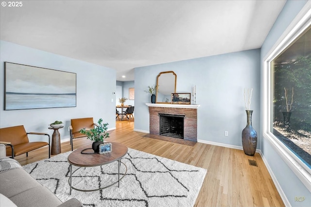 513 SE 103rd Ave, Vancouver, WA 98664 - living area with wood finished floors, baseboards, and a fireplace