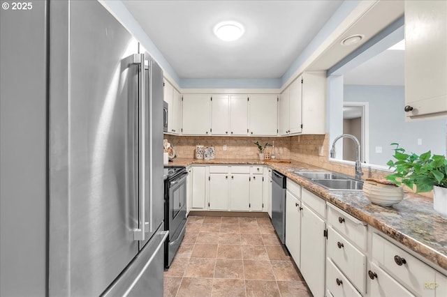 513 SE 103rd Ave, Vancouver, WA 98664 - kitchen with a sink, stainless steel appliances, decorative backsplash, stone finish flooring, and white cabinets